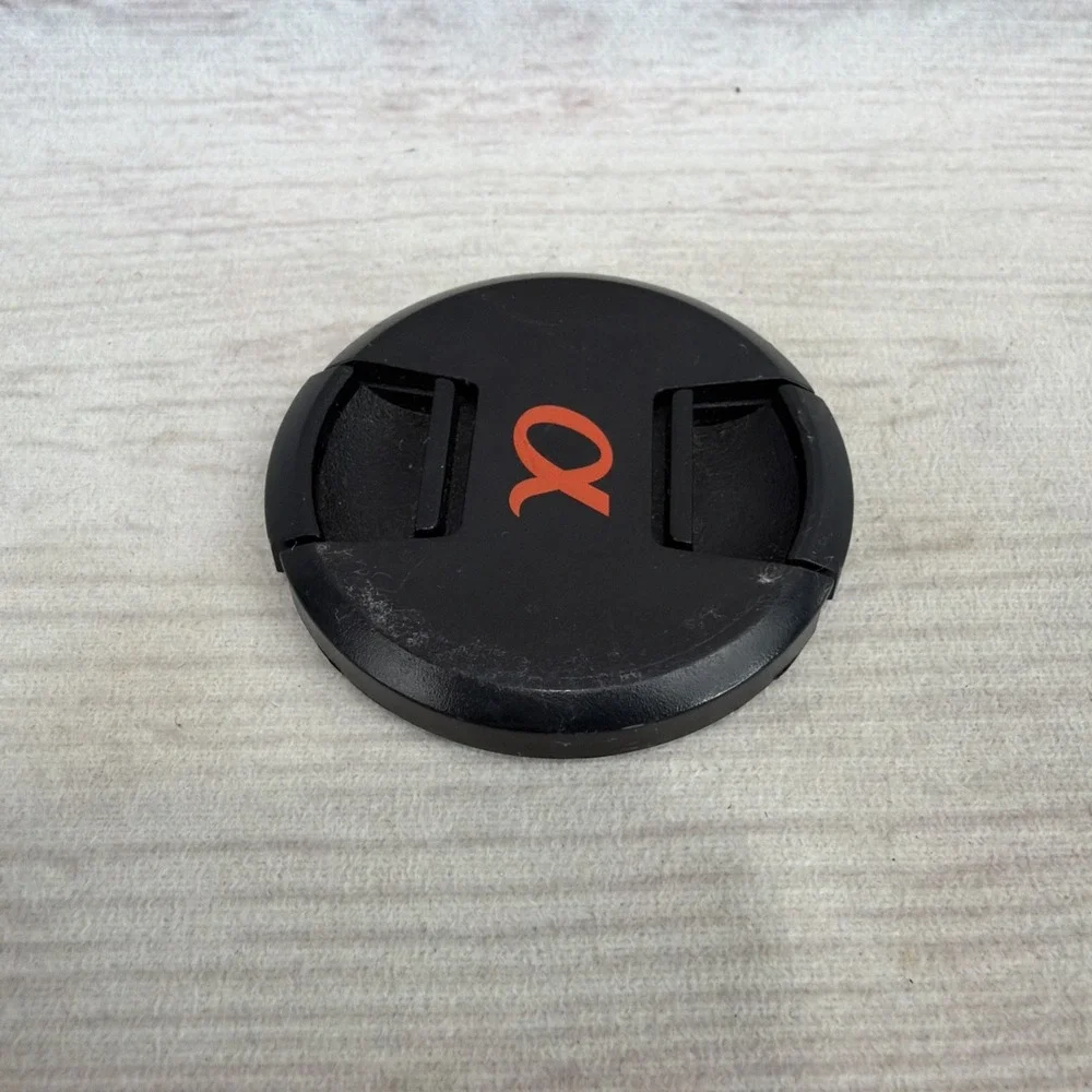 SONY ALPHA 55mm LENS FRONT COVER Black Genuine